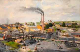 Village en pleine activité : une usine au milieu de l'image rejette de la fumée sur le village et sur ses habitants